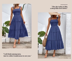Detail of navy blue tiered maxi dress with smocked bodice and elegant shoulder straps