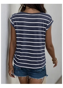 Detail of navy and white striped T-shirt featuring gold button accents on the sleeve
