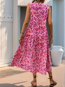 Detailed back view of a tiered boho maxi dress with purple floral print and ruffle layers