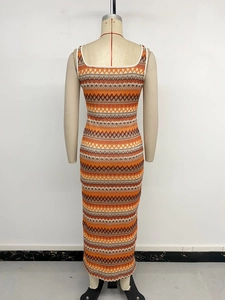 Back view of a sleeveless knitted maxi dress featuring orange and brown geometric patterns