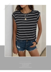 Close-up of sleeveless striped T-shirt featuring decorative gold buttons on the shoulder