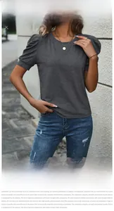 Detail shot of elegant puff sleeve pleats on a casual grey round neck T-shirt