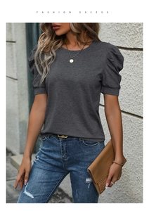 Close-up of women's dark gray knit top featuring stylish puff sleeves and round neckline