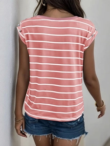 Detail view of pink and white striped shirt with decorative silver shoulder buttons