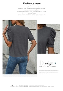 Detailed close-up of dark grey puff sleeves on casual women's summer t-shirt