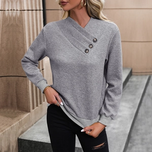 Women's light grey pullover sweatshirt with quilted texture and buttoned wrap neck