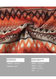 Macro detail of bohemian crochet knit fabric with orange and brown wave patterns