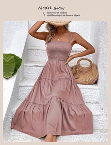 Detail of smocked bodice and tiered ruffle hem on a dusty rose summer maxi dress
