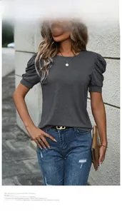 Detail of grey puff sleeve t-shirt fabric texture and shoulder design on model outdoor