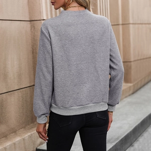 Women's grey long sleeve sweatshirt with diamond quilted texture and ribbed hem back view