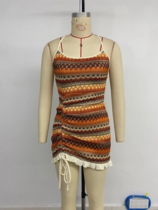 Detail of bohemian knit mini dress with colorful zigzag patterns and side drawstring
