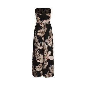 Détail de l'imprimé palmier tropical sur une combinaison bustier noire à jambes larges