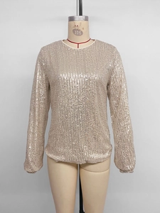 Detail of champagne gold sequins on long sleeve party shirt with vertical striped texture
