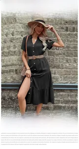 Detailed view of black V-neck tiered midi dress with woven belt and side slit design