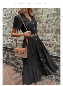 Detail of short-sleeve V-neck shirt dress with buttons, layered hem and woven belt