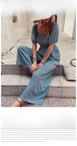 Close-up of blue floral jumpsuit featuring square neckline and puff sleeve details