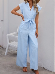 Detail of blue and white vertical striped jumpsuit with V-neck, buttons and waist tie