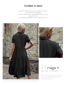 Detail of a black tiered midi dress showing the shirt collar and elegant back view