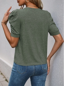 Rear view of women's army green t-shirt featuring elegant puff sleeves and textured fabric