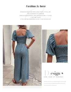 Detail of floral print jumpsuit with square neck, puff sleeves and smocked back design