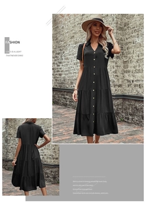 Detail view of a black short-sleeve midi shirt dress with layered tiered skirt design