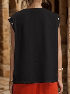 Rear view of women's black sleeveless top featuring gold shoulder button accents