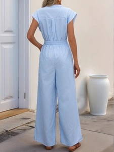 Back view of a striped blue and white V-neck jumpsuit with a high-waist tie belt detail