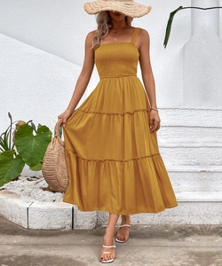 Detail of square neckline and elastic smocking on mustard yellow maxi dress