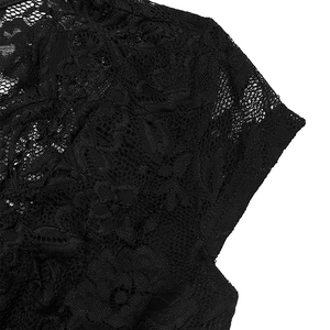 Close-up of black floral lace fabric featuring intricate rose patterns and mesh texture