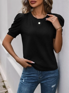 Detailed close-up of a women's black T-shirt featuring stylish puff sleeves and round neck
