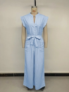 Detailed view of sleeveless v-neck jumpsuit with blue vertical stripes and waist tie