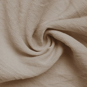 Gros plan sur la texture du lin neutre montrant les détails du tissage naturel respirant