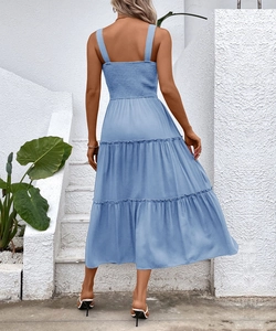 Detail of the light blue smocked back and wide straps on a tiered midi sundress
