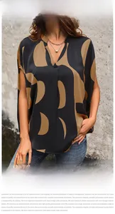 Detail of V-neck loose chiffon top featuring brown abstract geometric prints on black fabric