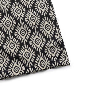 Detail shot of boho geometric diamond patterns on lightweight woven wide-leg jumpsuit
