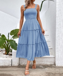 Detail of light blue square neck tiered summer dress with smocked bodice design