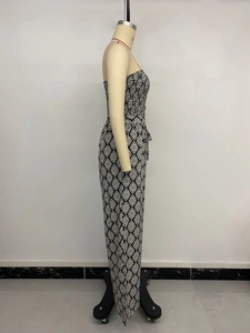 Detail of smocked strapless jumpsuit featuring black and white geometric diamond pattern