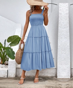 Detail of smocked bodice and tiered hem on this light blue summer vacation midi dress