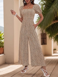 Close-up of floral print jumpsuit featuring square neck and short puff sleeves