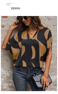 Close-up of women's V-neck top featuring geometric pattern and batwing sleeves