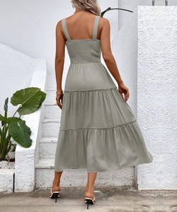 Detail of tiered summer maxi dress back with smocked texture in sage green fabric