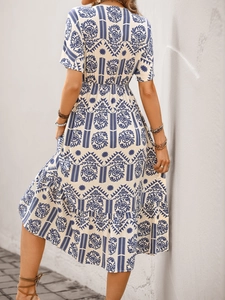 Detailed pattern view of a blue and white bohemian floral print summer midi dress