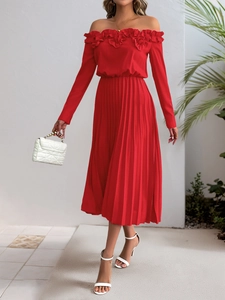 Detail of red off-shoulder pleated dress with ruffled neckline and chiffon texture