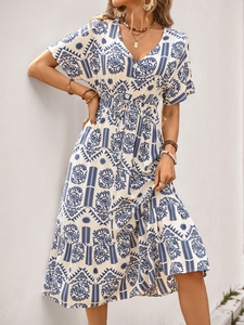 Detail of bohemian floral print and button-up V-neckline on summer A-line dress