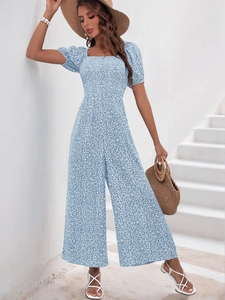 Close-up of a blue floral jumpsuit with puff sleeves and square neckline for summer