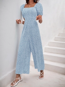 Detail of floral wide-leg jumpsuit with square neck and puff sleeves for summer style