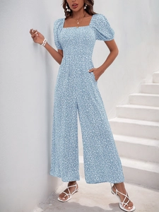 Summer blue floral jumpsuit featuring a square neck, puff sleeves and side pockets detail