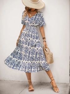Detail of bohemian floral A-line summer dress with V-neckline and geometric patterns