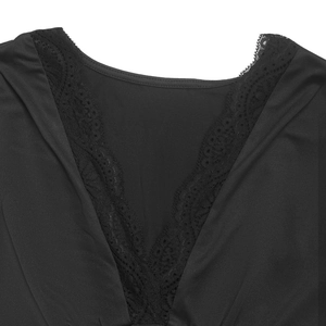 Close-up of elegant V-neckline with delicate lace patchwork on black bodysuit for women