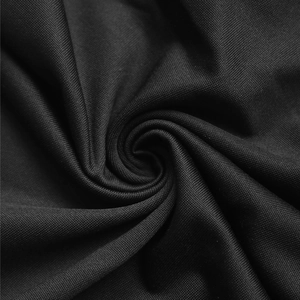 Macro shot showing the fine texture and draped luster of black lace-up bodysuit fabric